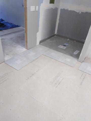Tile and Stone shower being installed in Spokane area home Remodel project.  New floor and Drywall going in 