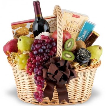 A classic basket filled with fresh fruit, gourmet, and wine.
