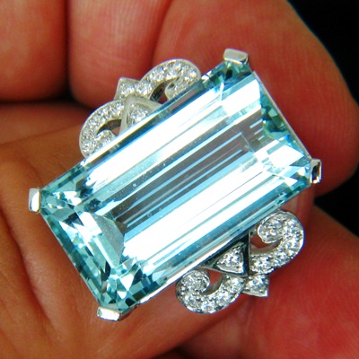 intense pool blue aquamarine of near thirty carats, untreated and lens clean in platinum