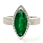 white gold and diamonds with 3 carat unoiled carats Zambian emerald in marquise shape