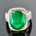 white gold and diamonds with four carat unoiled carats Zambian emerald 