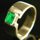 0.74 carat sandawana emerald in gold ring