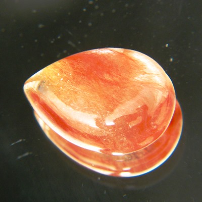 untreated natural rutile red in colorless single cabochon called strawberry quartz