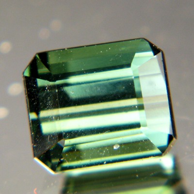 dark blue green tourmaline without inclusions or treatments emerald cut IGI report