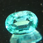 oval zambian one carat emerald with blue-green open clean crystal