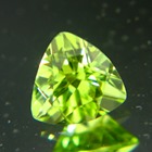 Precision cut unheated neon green Burma peridot in trillion and IGI report for bespoke jewelry