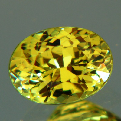 lime green garnet in natural untreated oval from west africa