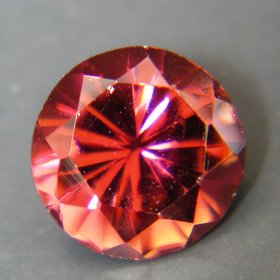 deep red-orange rubelite free of treatments, round and over 6 carat