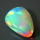 water opal over 4 carats with untreated all colors in neon welo opal pear shape with broad flames an