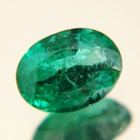 oval zambian sub carat emerald with big face but no window pure green