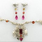 various natural unheated and untreated gemstones set in necklace, earrings and bracelets