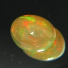 untreated crystal fire rainbow colored oval water welo opal in flat cabochon half single