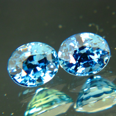 untreated blue sapphires over in exactly matching pair ovals