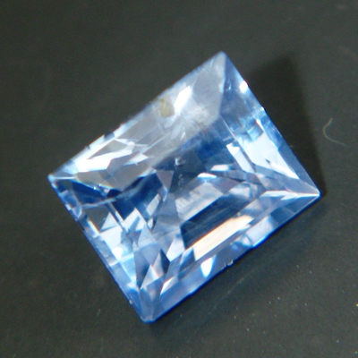cold sky blue rectangular pyramid cut sapphire from Ceylon, unheated and natural, no window, IGI rep