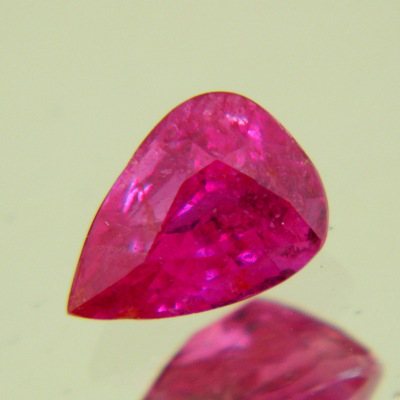 neon red untreated ruby pear shaped with potential pair at 2.06 carat